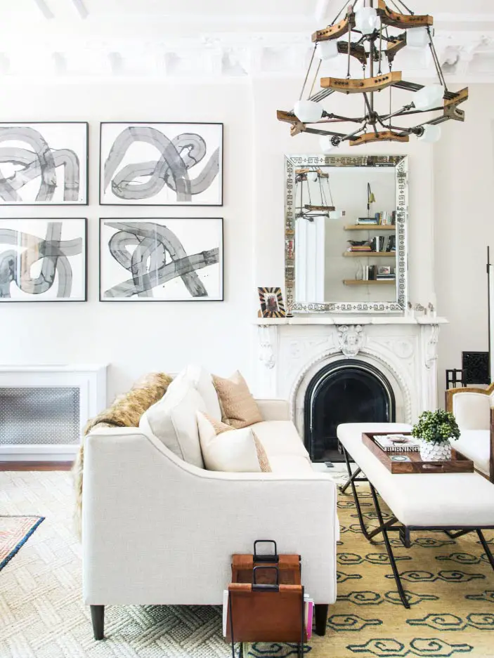 Neutral living room design with black and white abstract art and facing sofas on Thou Swell @thouswellblog