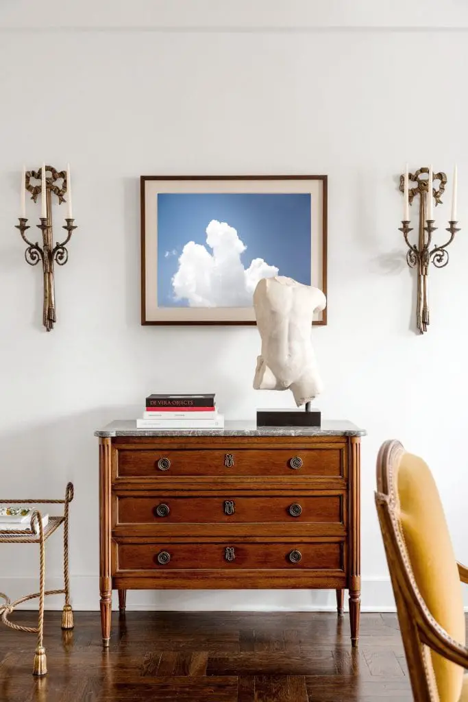 Cloud photography art print by Kevin O'Gara above antique dresser in New York apartment design on Thou Swell #clouds #sky #photography #artprint #homedecor #homedecorideas #homedesign