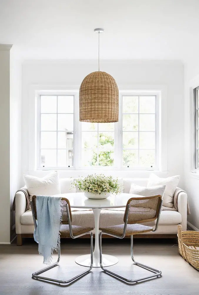 Cane Cesca chairs with wicker pendant in banquette dining nook breakfast table on Thou Swell @thouswellblog